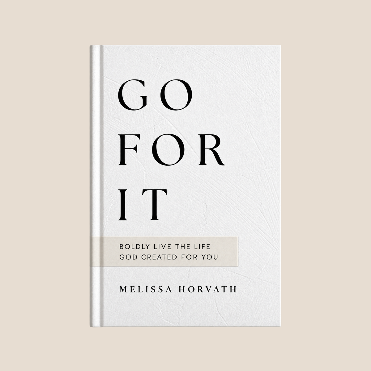 A hardcover book titled 'GO FOR IT' by Melissa Horvath, featuring a textured off-white cover with bold black typography and a light beige banner, set against a solid beige background.