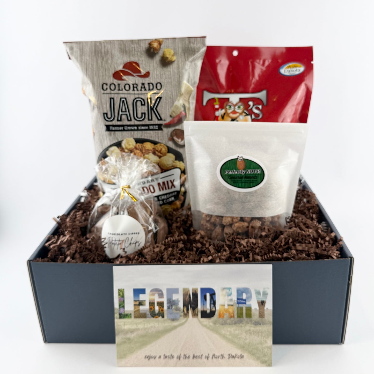 Gift box with snacks and a card labeled 'Legendary' on a white background