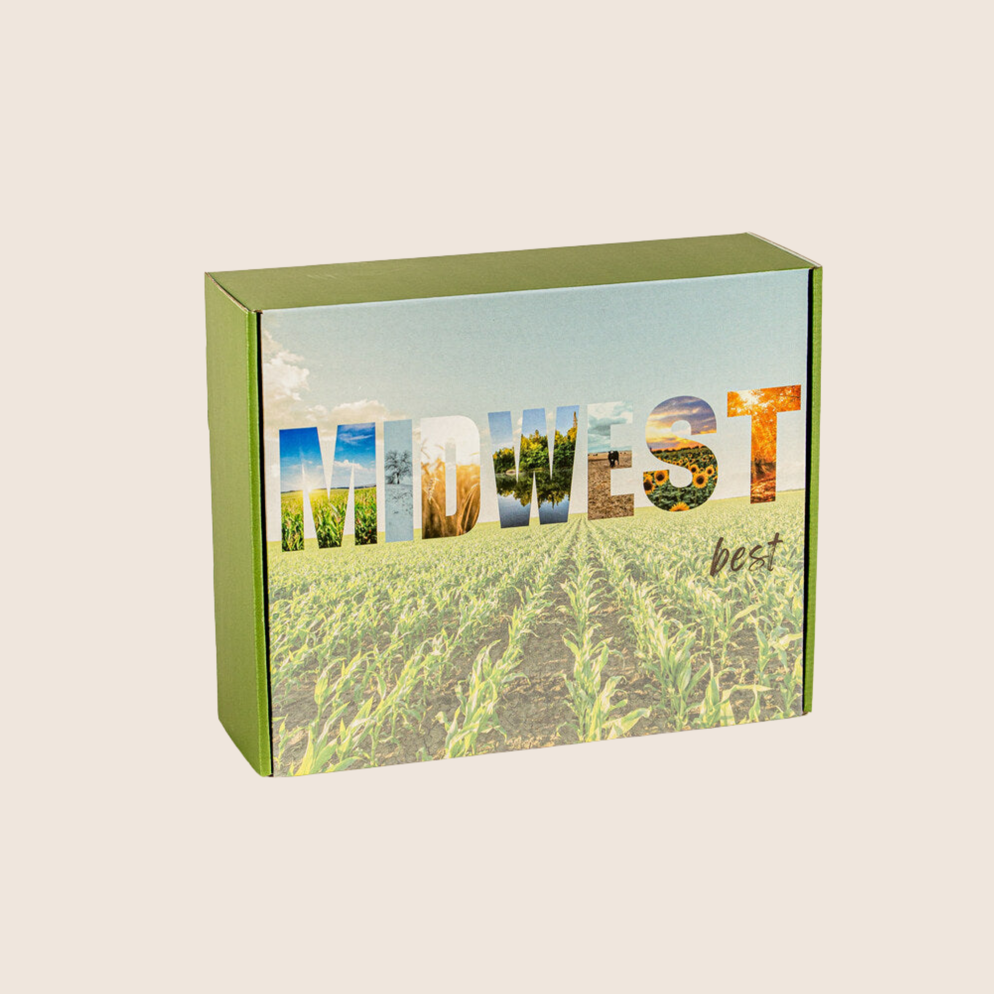 A rectangular green gift box with a printed Midwest landscape design on the lid, featuring the word 'MIDWEST' filled with scenic photos and the phrase 'best' in script, shown on a plain light beige background.