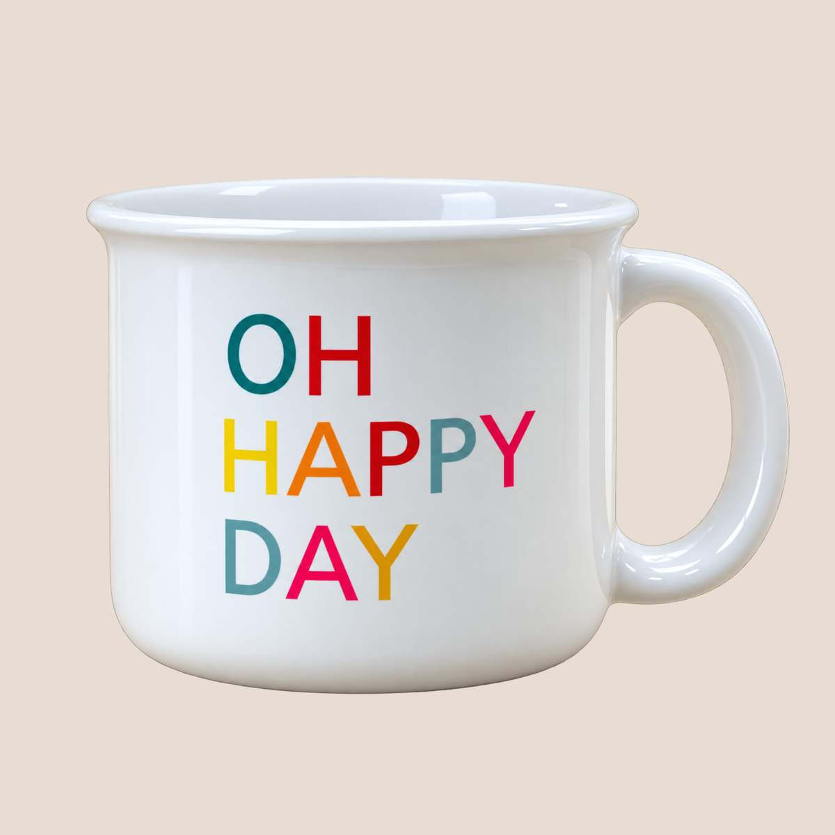 A white ceramic mug with the phrase 'OH HAPPY DAY' printed on the front in colorful, playful lettering, set against a solid beige background.
