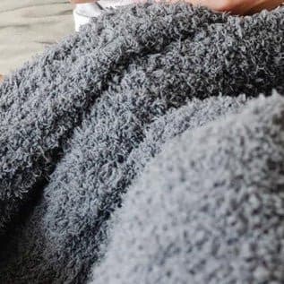 Saranoni Ribbed Bamboni Throw in the color charcoal