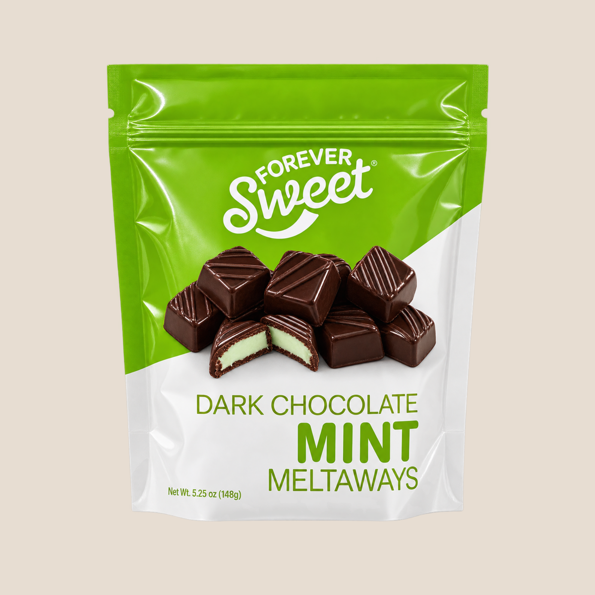A stand-up pouch of Forever Sweet Dark Chocolate Mint Meltaways on a solid light beige background. The packaging is bright green on the top half and white on the bottom, featuring an image of several chocolate-covered mint candies with one cut open to show the mint filling.