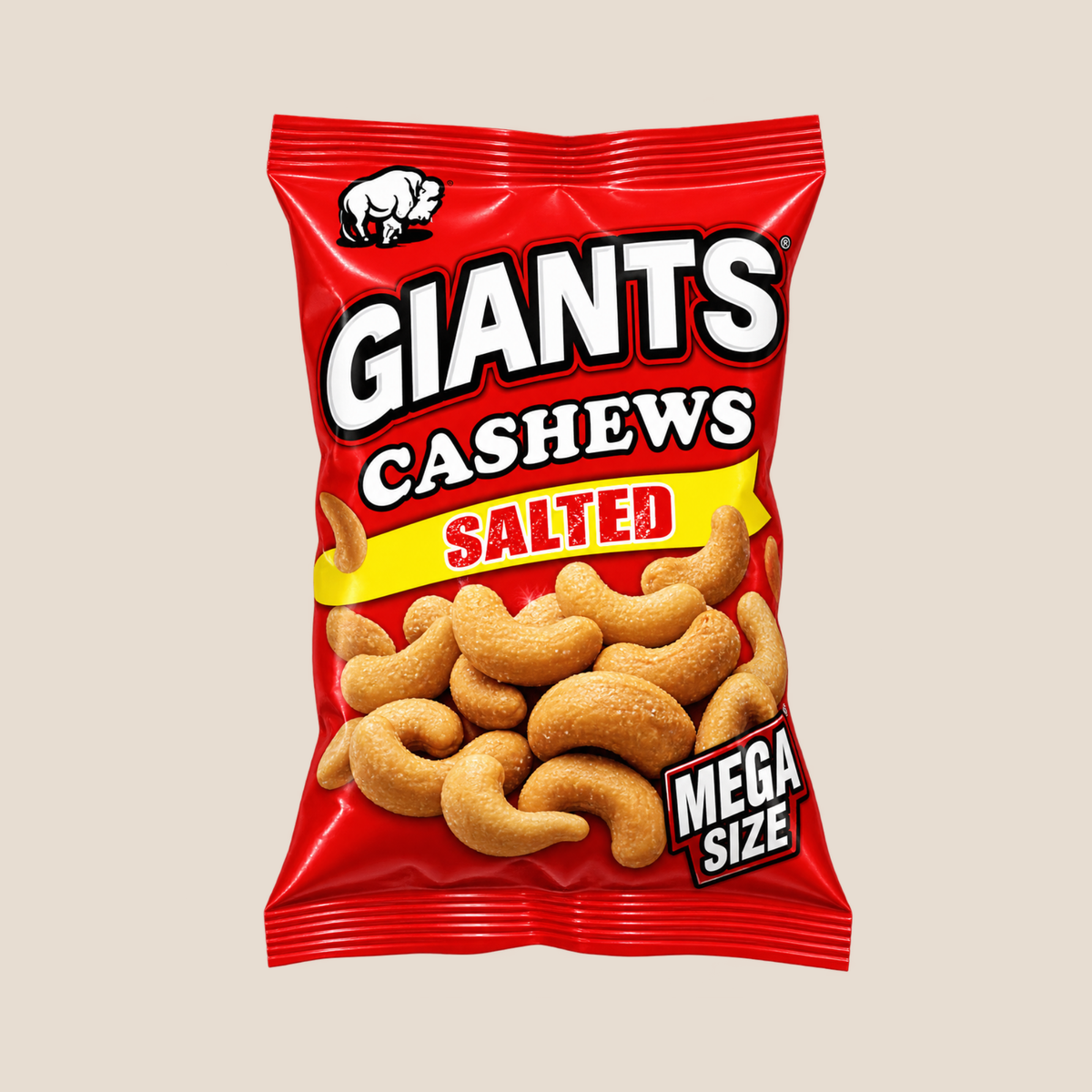 A red bag of Giants Cashews Salted Mega Size snack, featuring a white rhino logo and an image of cashews on the front, set against a solid beige background.