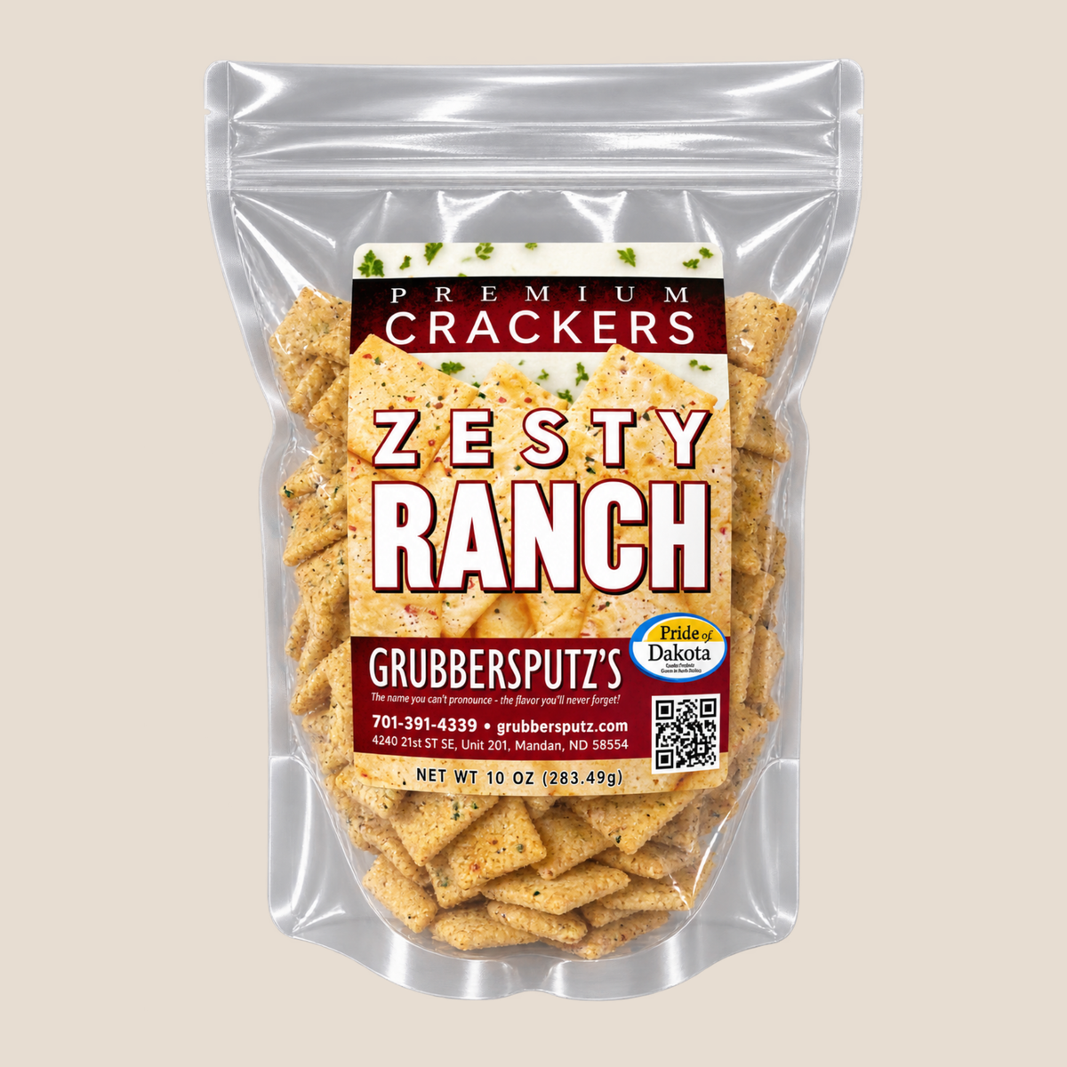 A 12 oz bag of Grubbersputz's Zesty Ranch Premium Crackers, shown in a clear stand-up pouch with a colorful label, set against a solid light beige background.