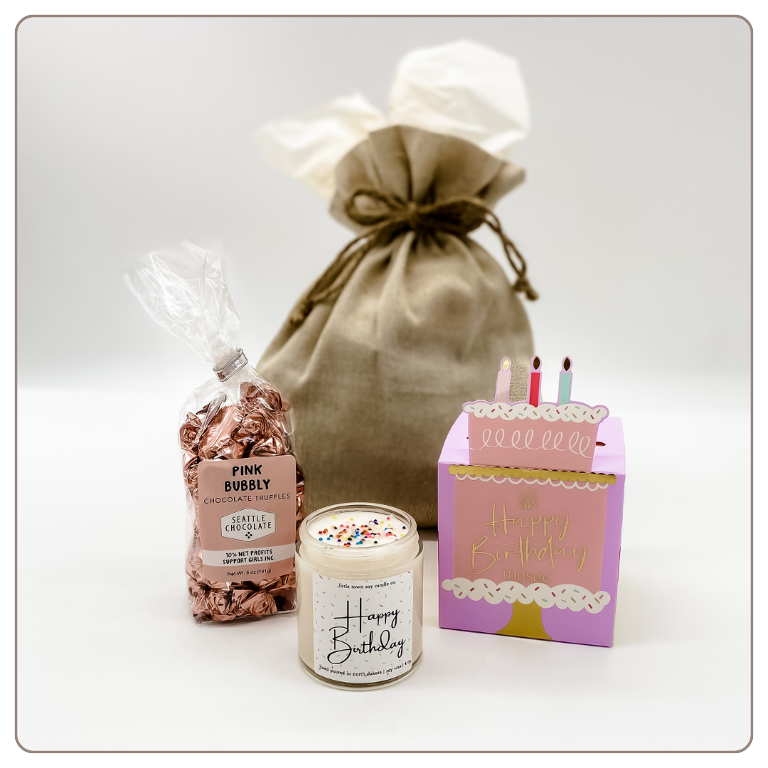 Linen gift bag with birthday candle, bath bomb, chocolate truffles