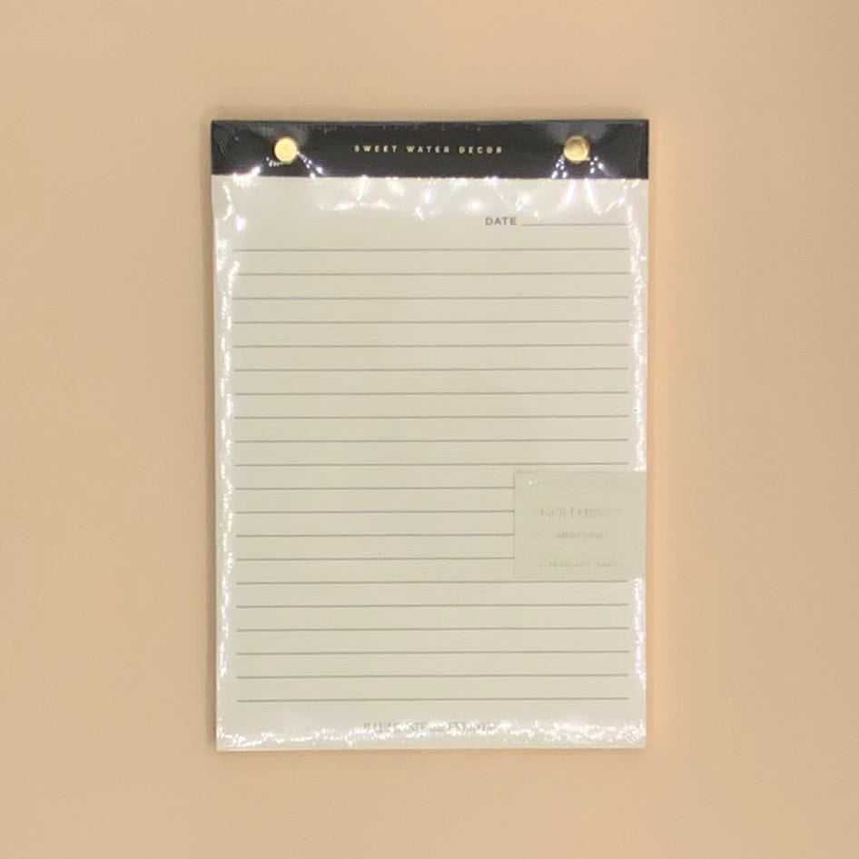notepad with gold rivets